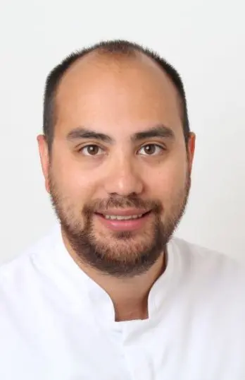 Dr Emanuele Clozza, dental implant surgeon at Lotus Dental and Aesthetics Clinic, Golders Green